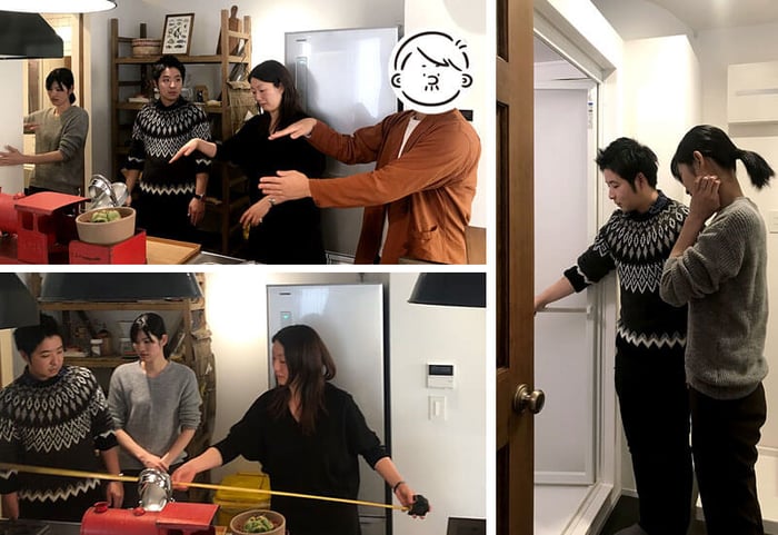 リノベる。桜木町ショールームのキッチン前に立つ設計担当とつむぱぱさんとご夫婦