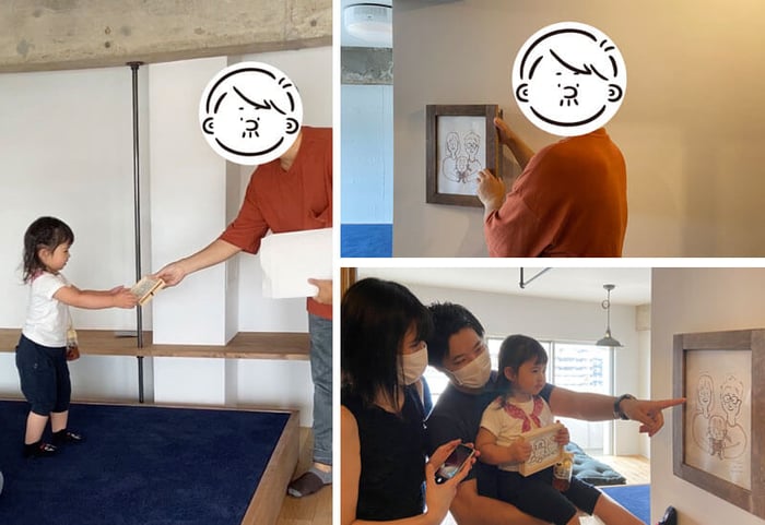 男性から絵を受け取る少女